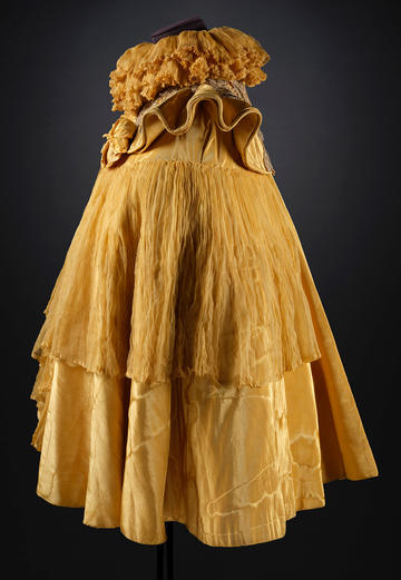 Shimmering and frilly yellow moire and chiffon cape with yellow satin lining c. 1898 Shimmering and frilly yellow moire and chiffon cape with yellow satin lining c. 1898