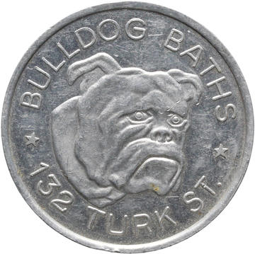 Bulldog Baths Token, 1980 - HCR115359 A silver token which shows the face of a bulldog. 'Bulldog Baths * 132 Turk St' is written around the image of the bulldog.