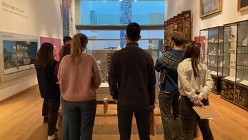 Krasis scholars discussing a Japanese lacquer cabinet in the West Meets East Gallery Krasis scholars discussing a Japanese lacquer cabinet in the West Meets East Gallery