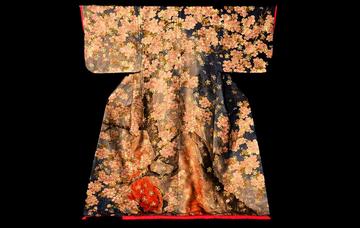 Kabuki kimono featuring blossom at night with design in swirls of pink, white and red border against grey