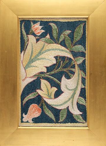 Rose and yew scrapbook cover by May Morris showing a colourful embroidery of flowers and leaves in a gold frame