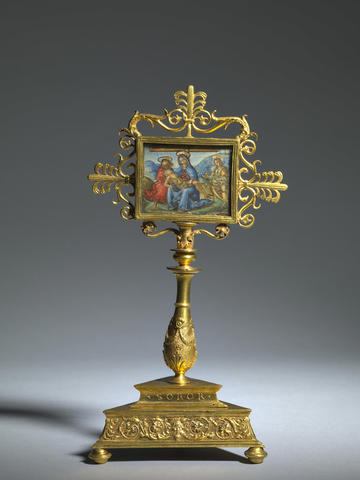 A gold renaissance reliquary featuring a religious painting