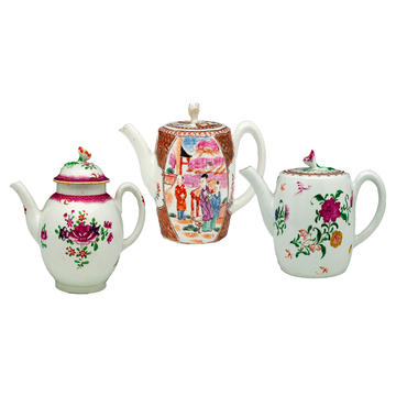 Three decorative porcelain teapots with spouts all pointing to the left 