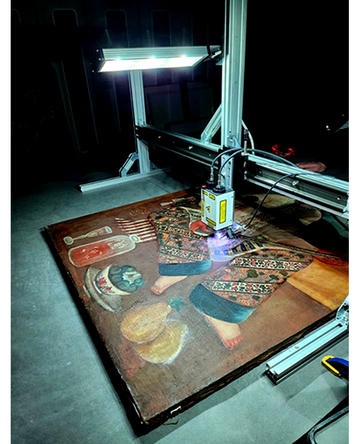 Examining Setar player painting Examining the Setar player painting with conservation equipment