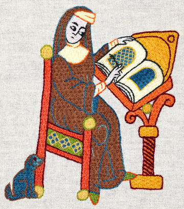 Medieval-style Embroidery of Hildegarde sitting writing at a desk by Tanya Bentham