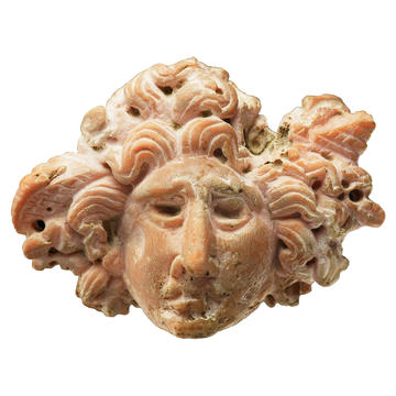 Carved stone in the form of the head of Medusa with snakes for hair