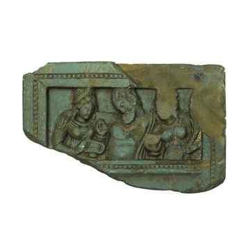 Lid or palette with the drunken Heracles supported by two female attendants, EA1993.24 Small carved relief with figures supporting the drunken god Heracles