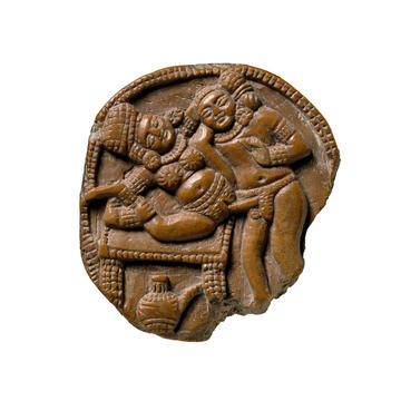 Ivory plaque depicting a couple making love