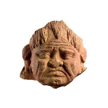 Sandstone head of a grimacing face
