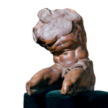 Sculpture of a male torso, with head and arms missing