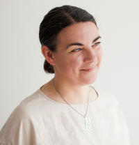 Portrait photo of artist Aliki Braine smiling
