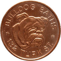 A copper colour token which shows a the image of a bulldog in the centre. 'Bulldog Baths * 132 Turk St.' is written around the image of the bulldog
