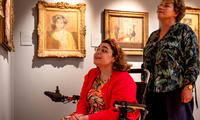Two visitors look at paintings in the Sickert Gallery at the Ashmolean