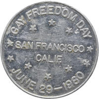 The reverse of an aluminium token 'Gay Freedom Day June 29 1980' is written around the coin and across the middle is written 'San Francisco, Calif.'.