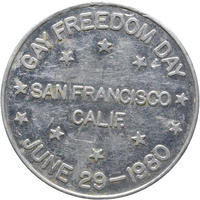 Reverse of a Bulldog Bath token, 1980 - HCR115359 The reverse of an aluminium token 'Gay Freedom Day June 29 1980' is written around the coin and across the middle is written 'San Francisco, Calif.'.