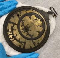 An astrolabe being examined at Krasis