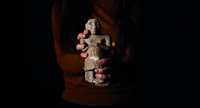 A woman holding an ancient Mesopotamian figurine