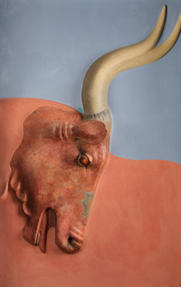 Replica of bull’s head fresco from the North Entrance of the palace of Knossos Painted replica of a wall fresco showing the head of a bull in brigh terracotta colour, against a blue background